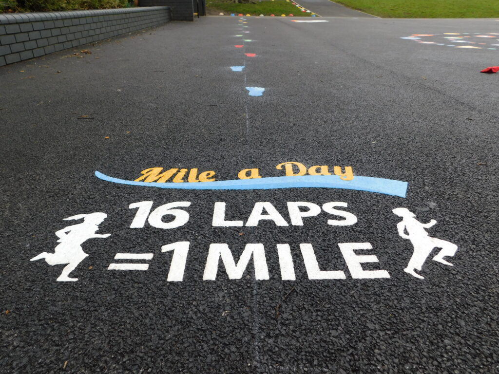 Thermoplastic daily mile and tracks playground markings at a UK school
